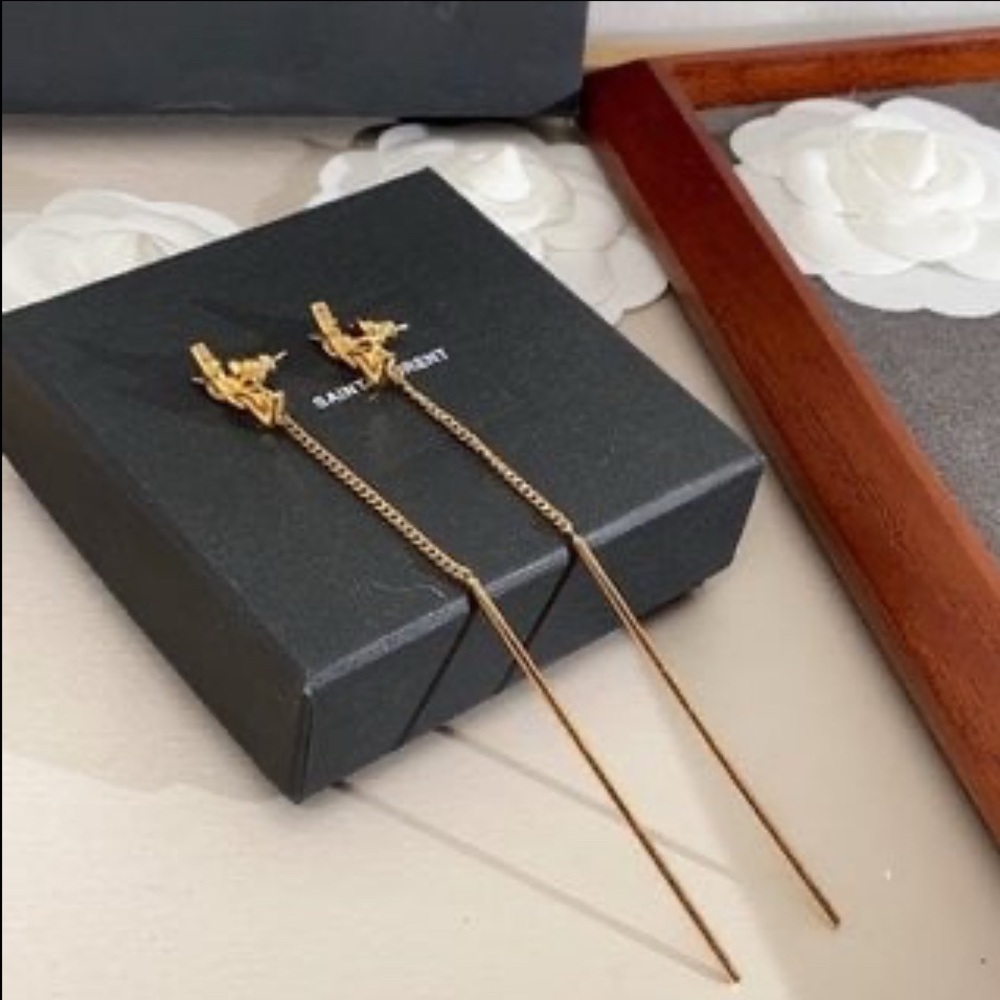 New Yves Saint Laurent long drop gold earrings.